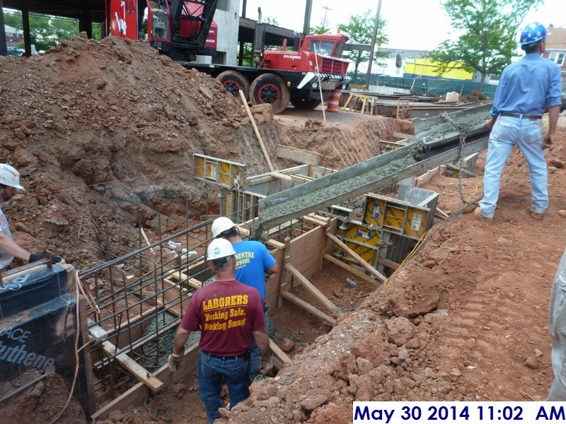 Pouring concrete at Foundation wall along column line 6.5 Facing South-West (800x600)